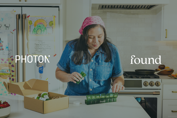 Lifestyle image of a woman looking at her medication delivered by Found